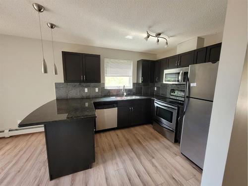 7-118 Village Heights Sw, Calgary, AB - Indoor Photo Showing Kitchen With Stainless Steel Kitchen With Upgraded Kitchen