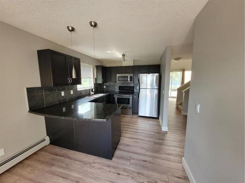 7-118 Village Heights Sw, Calgary, AB - Indoor Photo Showing Kitchen With Stainless Steel Kitchen