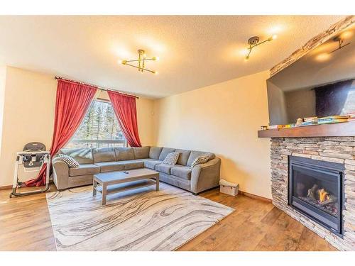 130 Topaz Gate, Chestermere, AB - Indoor Photo Showing Living Room With Fireplace