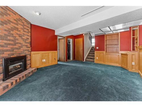 103 Silvergrove Place Nw, Calgary, AB - Indoor Photo Showing Other Room With Fireplace