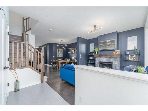 23 Walden Parade Se, Calgary, AB - Indoor With Fireplace