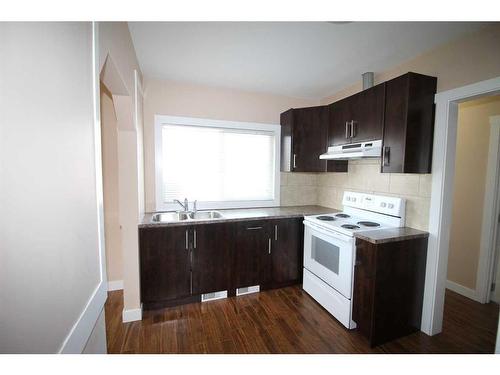 1302 11 Avenue Se, Calgary, AB - Indoor Photo Showing Kitchen With Double Sink