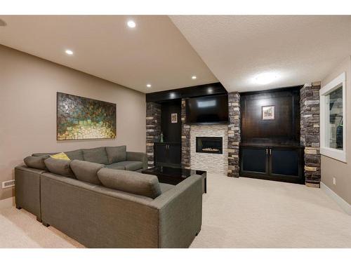 26 Aspen Dale Court Sw, Calgary, AB - Indoor Photo Showing Living Room With Fireplace