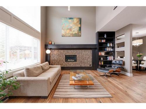 26 Aspen Dale Court Sw, Calgary, AB - Indoor Photo Showing Living Room With Fireplace