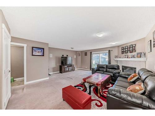139 Carmel Close Ne, Calgary, AB - Indoor Photo Showing Living Room With Fireplace