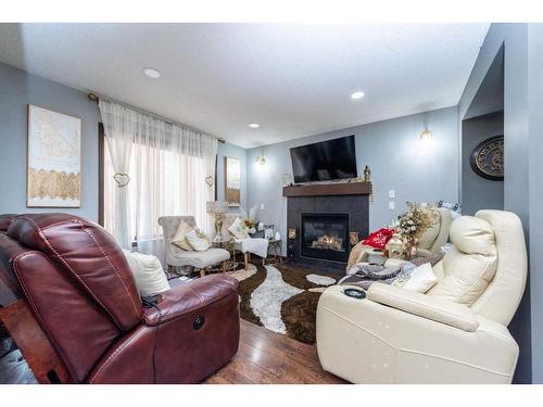 222 Saddlebrook Way Ne, Calgary, AB - Indoor Photo Showing Living Room With Fireplace