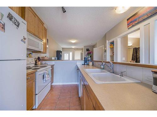 309-1540 17 Avenue Sw, Calgary, AB - Indoor Photo Showing Kitchen With Double Sink