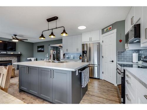 781 Cimarron Close, Okotoks, AB - Indoor Photo Showing Kitchen With Stainless Steel Kitchen With Upgraded Kitchen