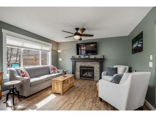 781 Cimarron Close, Okotoks, AB - Indoor Photo Showing Living Room With Fireplace