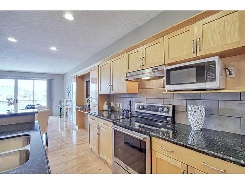 135 Everglade Way Sw, Calgary, AB - Indoor Photo Showing Kitchen With Upgraded Kitchen