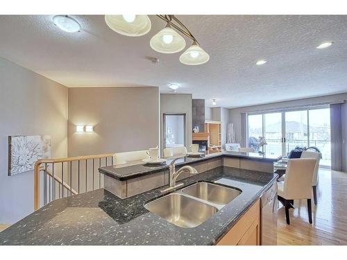 135 Everglade Way Sw, Calgary, AB - Indoor Photo Showing Kitchen With Double Sink