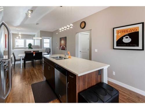 129 Fireside Place, Cochrane, AB - Indoor Photo Showing Kitchen With Double Sink