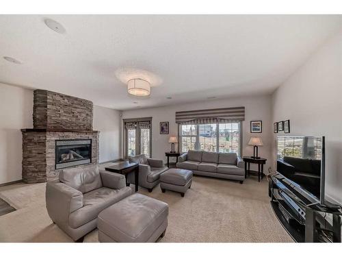 987 Bayside Drive Sw, Airdrie, AB - Indoor Photo Showing Living Room With Fireplace