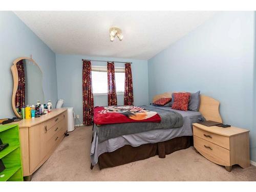 145 Hidden Spring Circle Nw, Calgary, AB - Indoor Photo Showing Bedroom