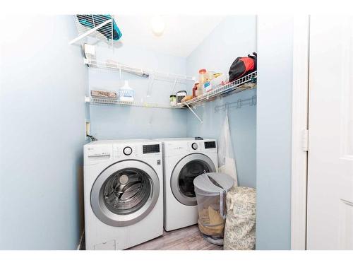145 Hidden Spring Circle Nw, Calgary, AB - Indoor Photo Showing Laundry Room