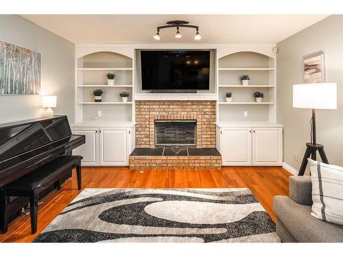 158 Sundown Place Se, Calgary, AB - Indoor Photo Showing Living Room With Fireplace