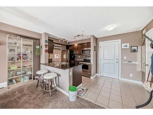 1417-625 Glenbow Drive, Cochrane, AB - Indoor Photo Showing Kitchen With Stainless Steel Kitchen