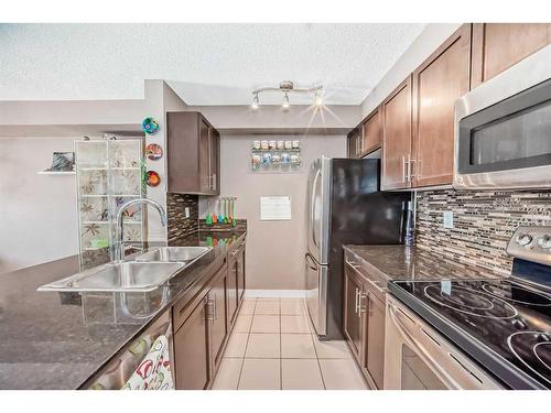 1417-625 Glenbow Drive, Cochrane, AB - Indoor Photo Showing Kitchen With Double Sink