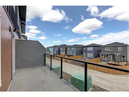 202-335 Creekside Boulevard, Calgary, AB - Outdoor With Balcony With Exterior