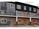 202-335 Creekside Boulevard, Calgary, AB  - Outdoor With Balcony With Facade 