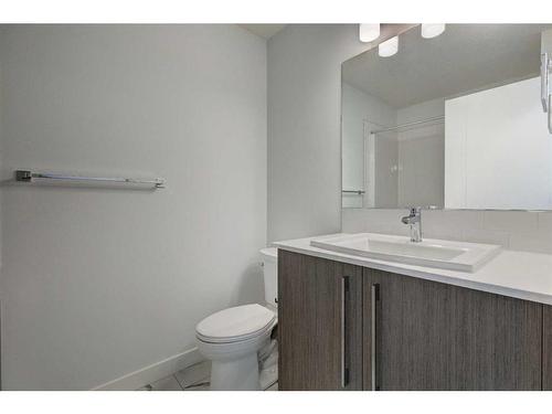 202-335 Creekside Boulevard, Calgary, AB - Indoor Photo Showing Bathroom