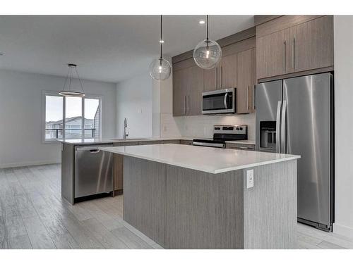 202-335 Creekside Boulevard, Calgary, AB - Indoor Photo Showing Kitchen With Upgraded Kitchen