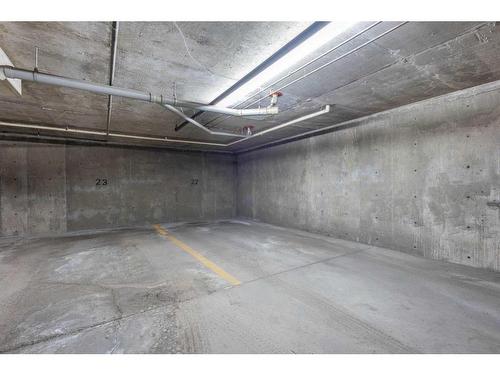 211-6000 Somervale Court Sw, Calgary, AB - Indoor Photo Showing Garage