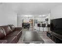 211-6000 Somervale Court Sw, Calgary, AB  - Indoor Photo Showing Living Room 