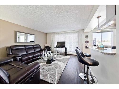 C301-4455 Greenview Drive Ne, Calgary, AB - Indoor Photo Showing Living Room