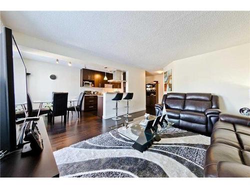 C301-4455 Greenview Drive Ne, Calgary, AB - Indoor Photo Showing Living Room