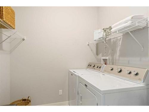 48 Sage Bluff Green Nw, Calgary, AB - Indoor Photo Showing Laundry Room