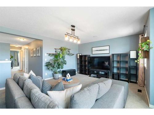 48 Sage Bluff Green Nw, Calgary, AB - Indoor Photo Showing Living Room