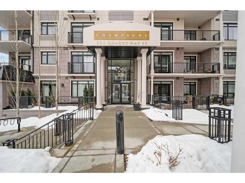 302-221 Quarry Way Se, Calgary, AB - Outdoor With Balcony With Facade