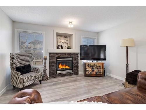 78 Everoak Gardens Sw, Calgary, AB - Indoor Photo Showing Living Room With Fireplace
