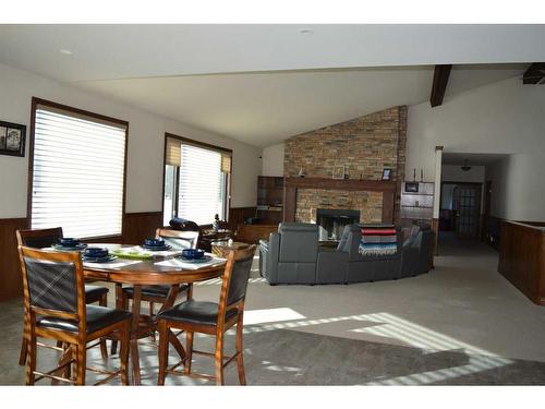 16117 Highway 552 Highway West, Rural Foothills County, AB - Indoor Photo Showing Dining Room With Fireplace
