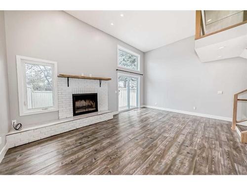 65 Millrise Lane Sw, Calgary, AB - Indoor Photo Showing Living Room With Fireplace