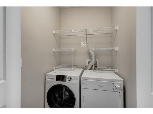 64 Auburn Meadows Boulevard Se, Calgary, AB - Indoor Photo Showing Laundry Room