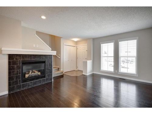 64 Auburn Meadows Boulevard Se, Calgary, AB - Indoor Photo Showing Living Room With Fireplace