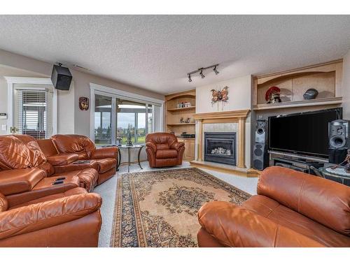 13 Panorama Hills Manor Nw, Calgary, AB - Indoor Photo Showing Living Room With Fireplace