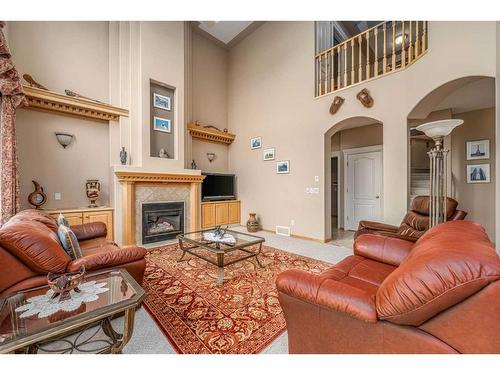 13 Panorama Hills Manor Nw, Calgary, AB - Indoor Photo Showing Living Room With Fireplace