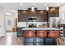 74 Buckskin Way, Cochrane, AB  - Indoor Photo Showing Kitchen With Stainless Steel Kitchen With Upgraded Kitchen 
