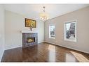 208 Mahogany Grove Se, Calgary, AB  - Indoor Photo Showing Living Room With Fireplace 