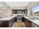 208 Mahogany Grove Se, Calgary, AB  - Indoor Photo Showing Kitchen With Stainless Steel Kitchen With Double Sink With Upgraded Kitchen 