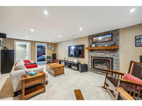 584 Bracewood Drive Sw, Calgary, AB - Indoor Photo Showing Living Room With Fireplace