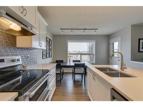 20 Tuscany Ravine Court Nw, Calgary, AB - Indoor Photo Showing Kitchen With Double Sink With Upgraded Kitchen