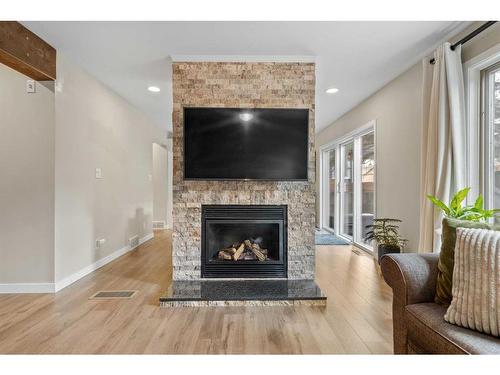 1048 Deer River Circle Se, Calgary, AB - Indoor Photo Showing Living Room With Fireplace