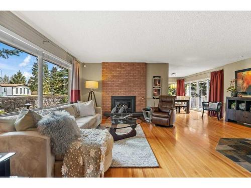 2331 Paliswood Road Sw, Calgary, AB - Indoor Photo Showing Living Room With Fireplace