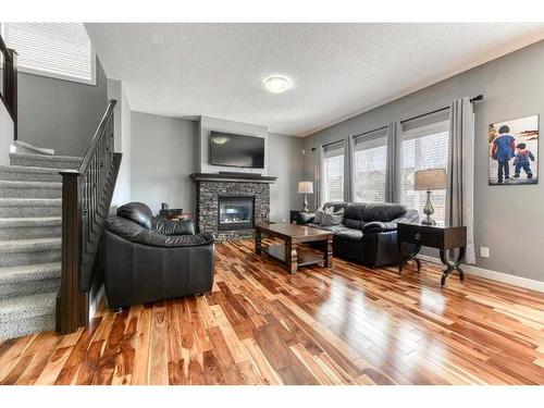 108 Wildrose Crescent, Strathmore, AB - Indoor Photo Showing Living Room With Fireplace