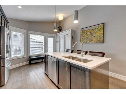 122 Sundown Close Se, Calgary, AB - Indoor Photo Showing Kitchen With Double Sink