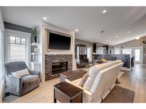 122 Sundown Close Se, Calgary, AB - Indoor Photo Showing Living Room With Fireplace